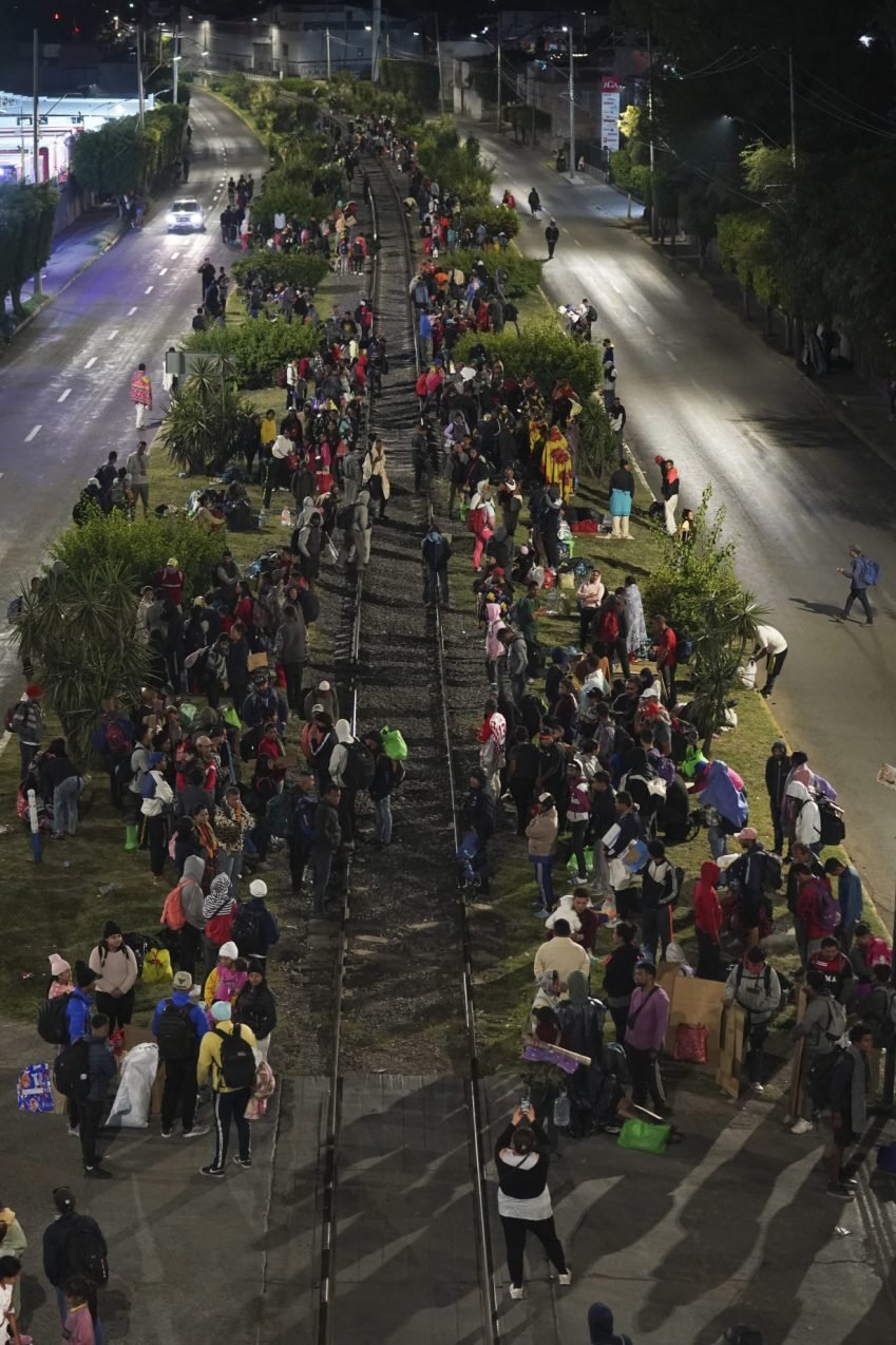 Migrants hoping to reach US continue north through Mexico by train amid historic migration levels