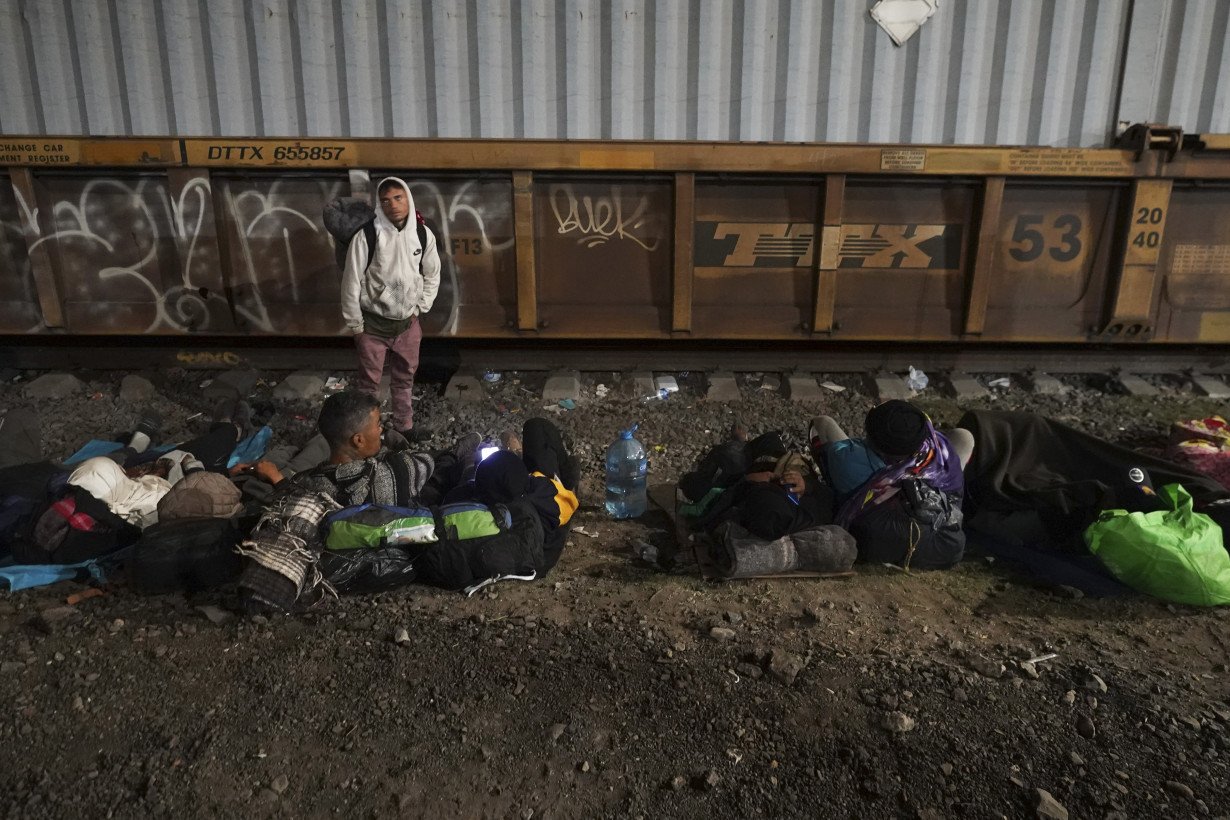 Migrants hoping to reach US continue north through Mexico by train amid historic migration levels