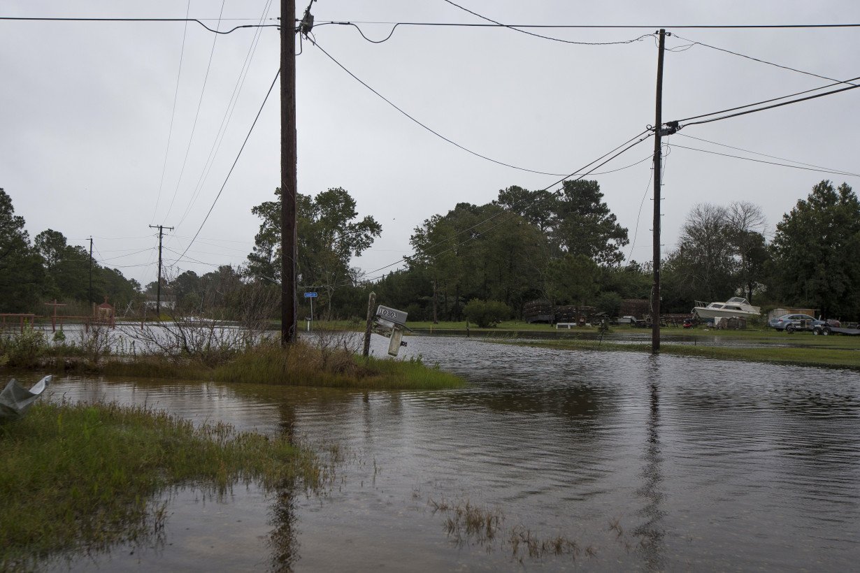 Southern East Coast hit by flooding as Ophelia weakens to tropical depression and moves north