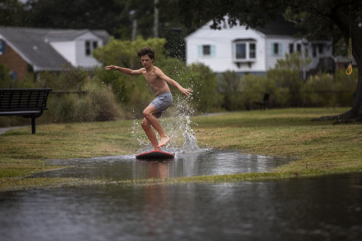 Southern East Coast hit by flooding as Ophelia weakens to tropical depression and moves north