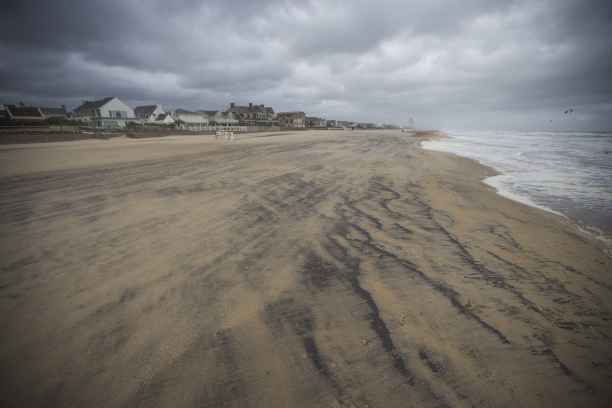 Southern East Coast hit by flooding as Ophelia weakens to tropical depression and moves north