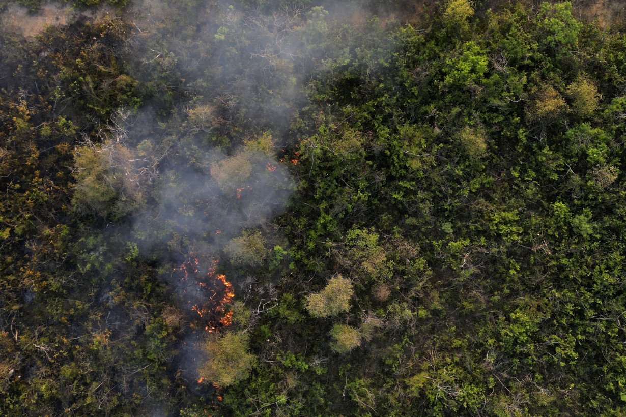 Brazil’s firefighters battle wildfires raging during rare late-winter heat wave