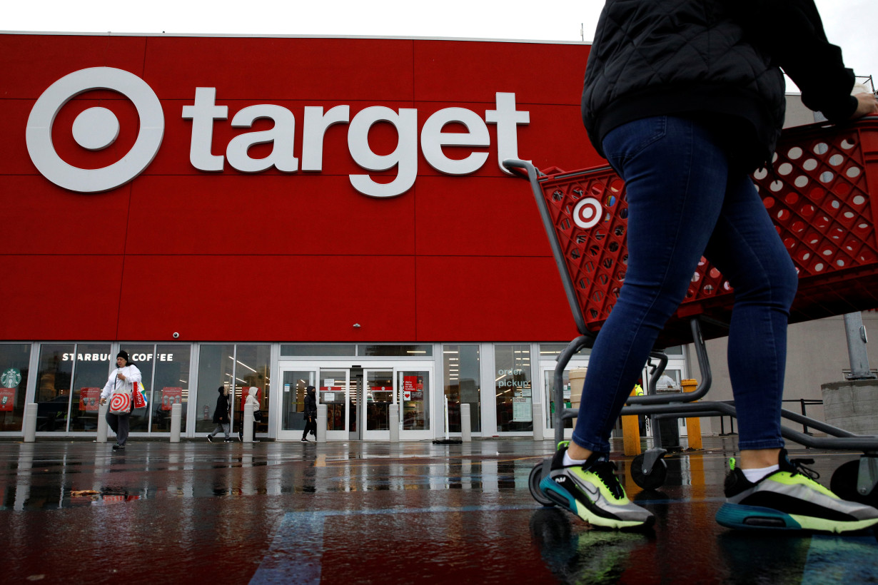 Shoppers exit a Target store during Black Friday sales in Brooklyn, New York