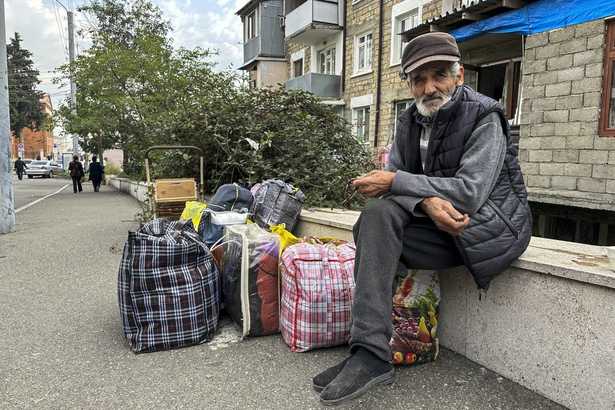 Over half of Nagorno-Karabakh's population flees as the separatist government says it will dissolve