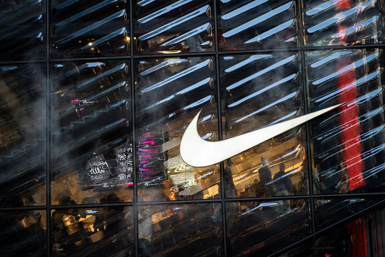 People visit the Nike store at 5th Avenue during the holiday season in New York