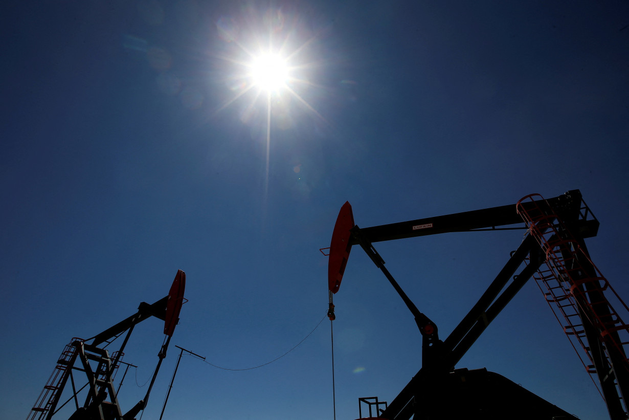 FILE PHOTO: Oil rigs are seen at Vaca Muerta shale oil and gas drilling, in the Patagonian province of Neuquen, Argentina