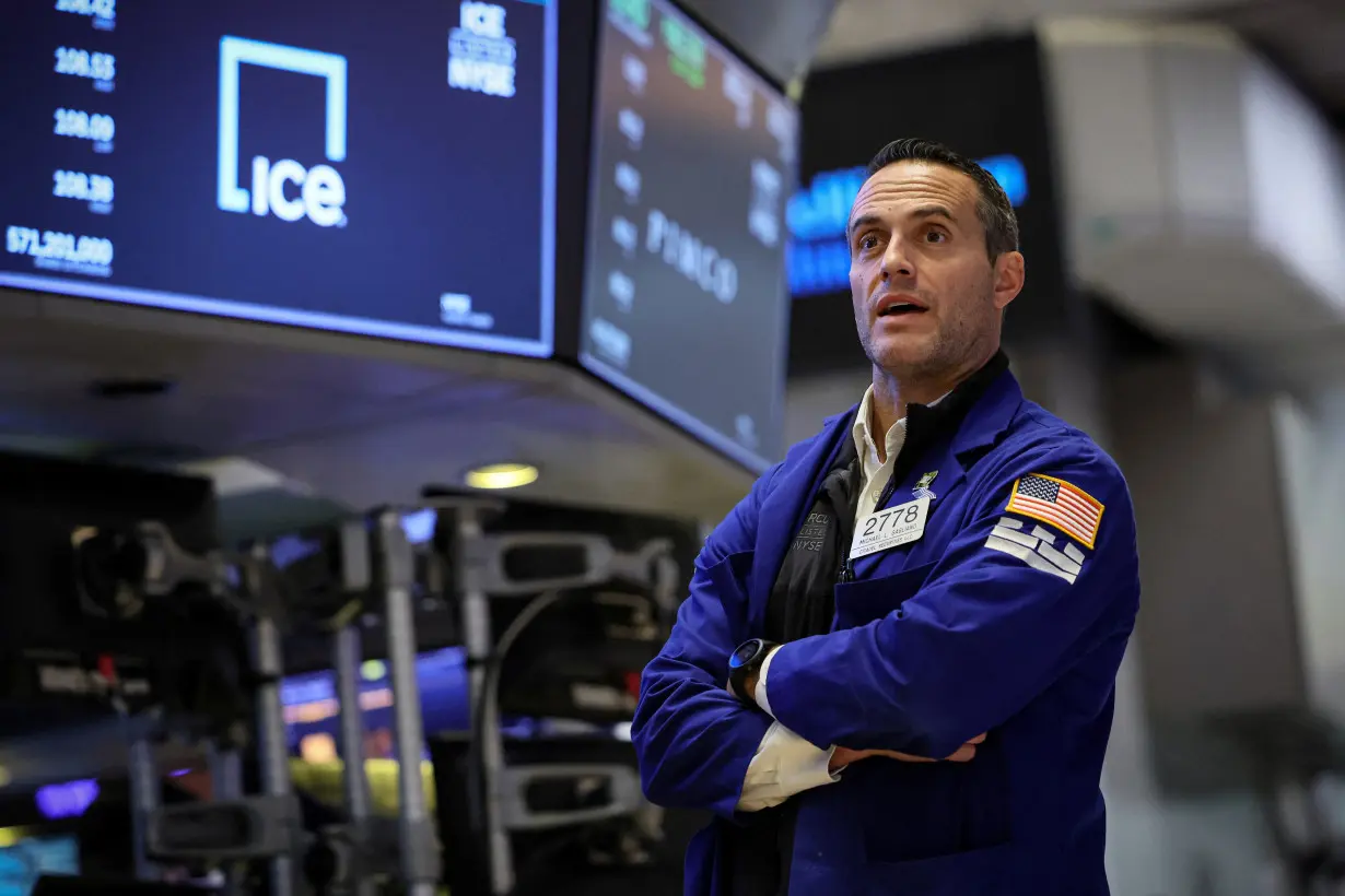 Traders work on the floor of the NYSE in New York