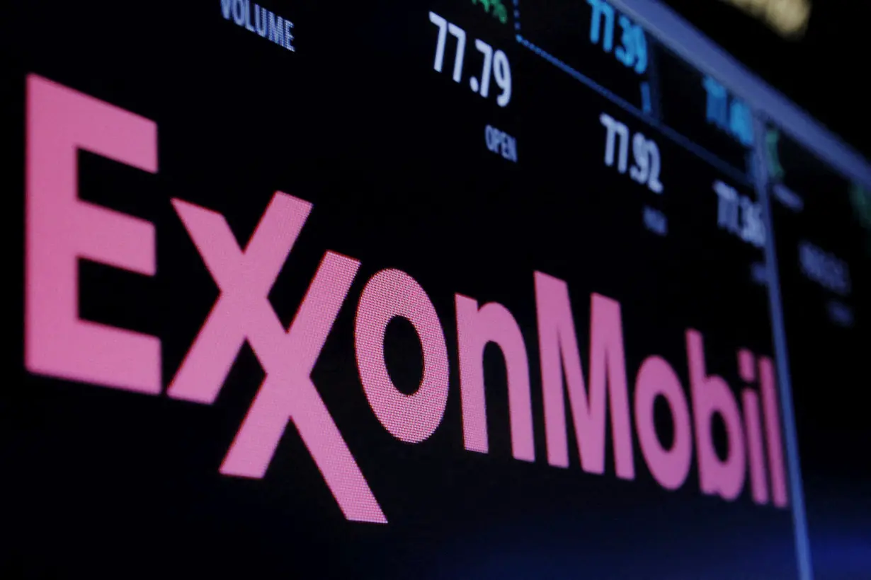 FILE PHOTO: The Exxon logo is displayed above the floor of the New York Stock Exchange (NYSE) shortly after the opening bell in New York