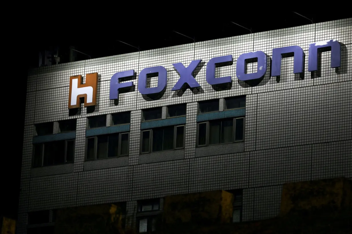 FILE PHOTO: The logo of Foxconn is seen outside a company's building in Taipei