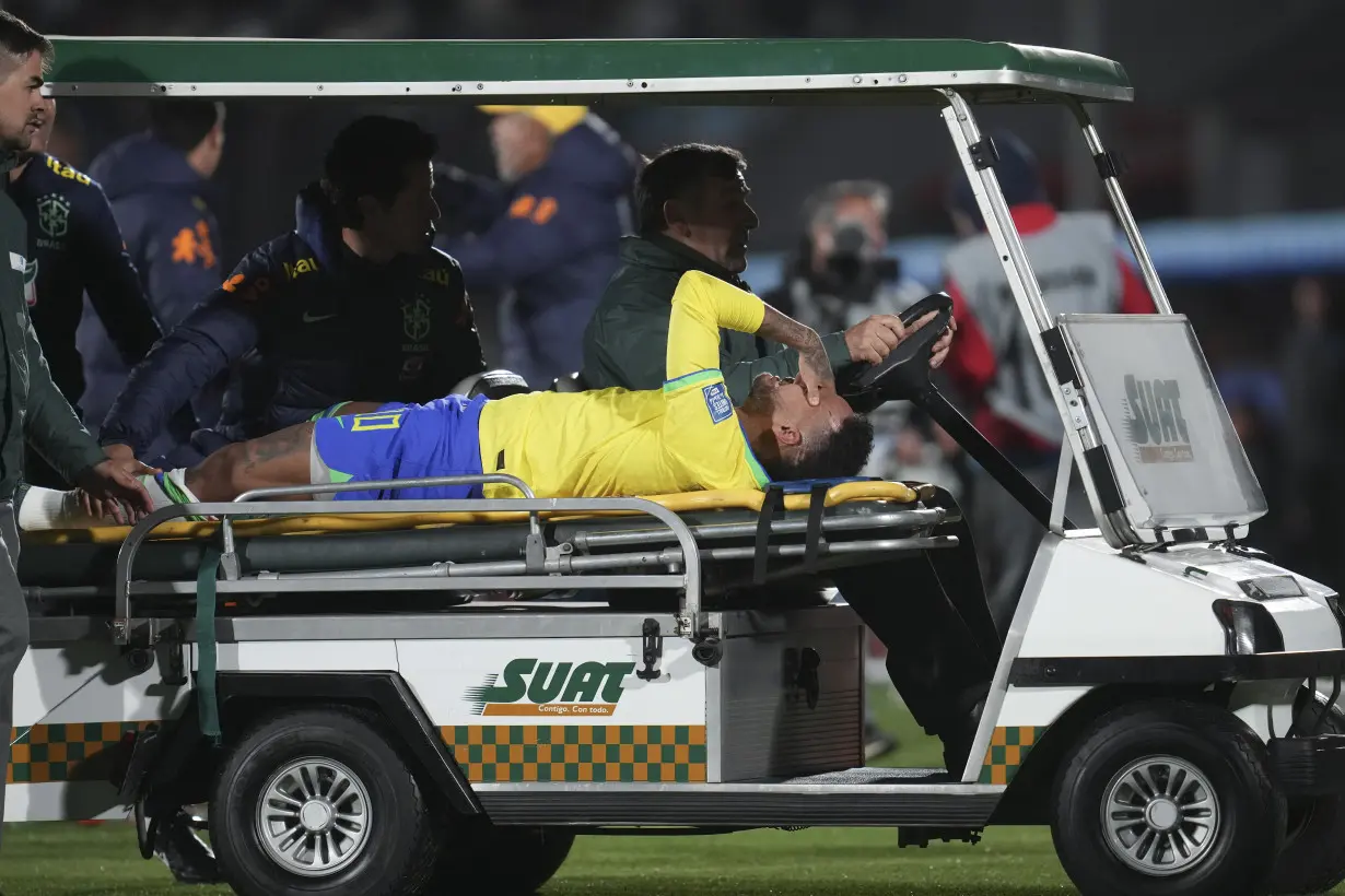 Neymar leaves Brazil match in tears with left knee injury; team doctor says severity unknown