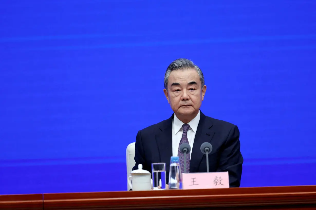 Chinese Foreign Minister Wang Yi attends a press conference in Beijing