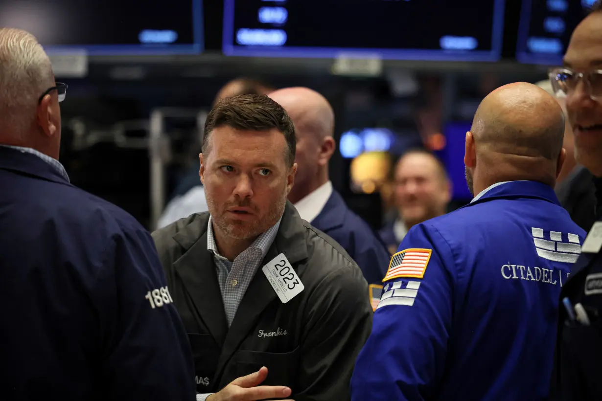 Traders work on the floor of the NYSE in New York