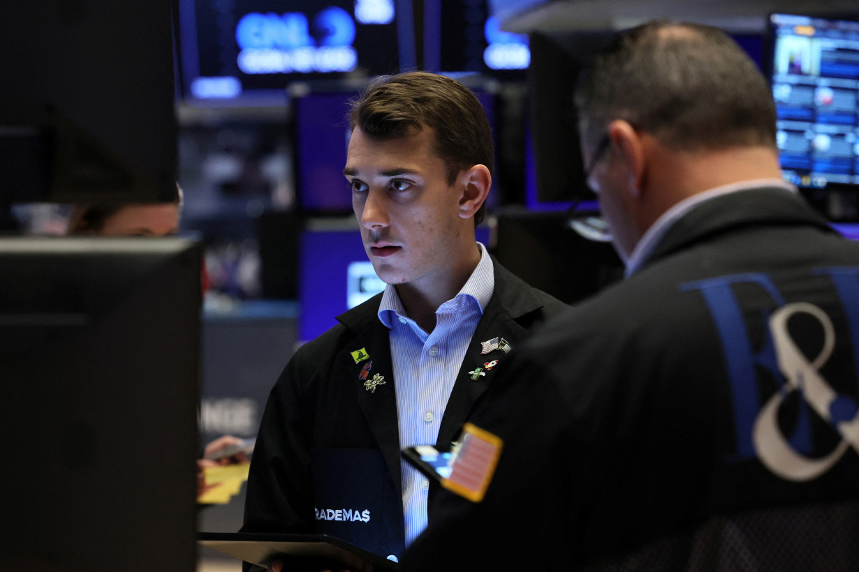 Traders work on the floor of the NYSE in New York