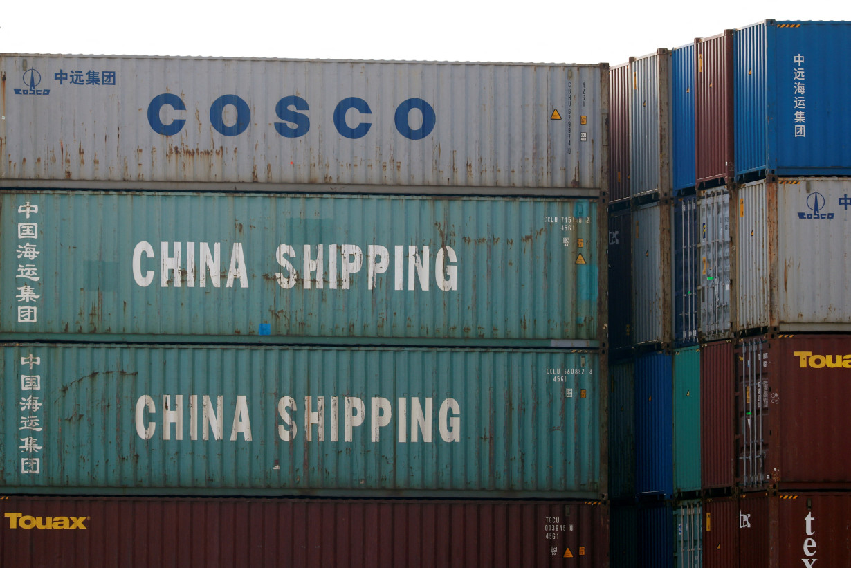 FILE PHOTO: Shipping containers of China Shipping and China Ocean Shipping Company are seen at the port of Antwerp