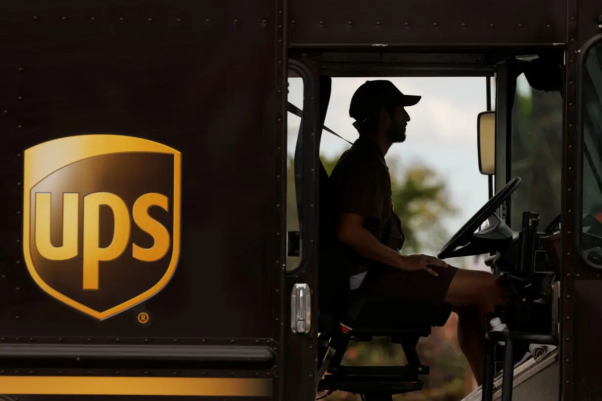 UPS delivery van is driven long a city street in Garden Grove, California