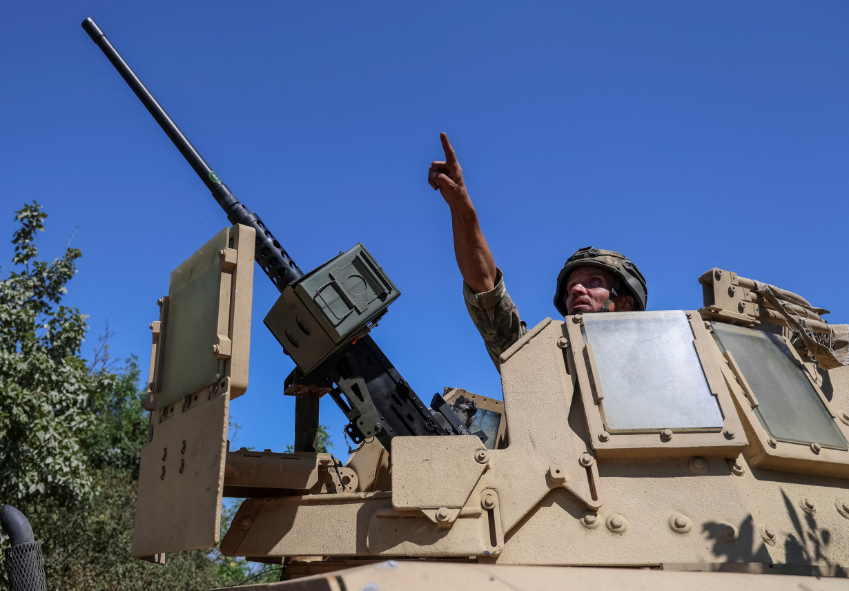 A member of an air-defence unit of the Ukrainian border guard is seen at his position at a front line in Donetsk region