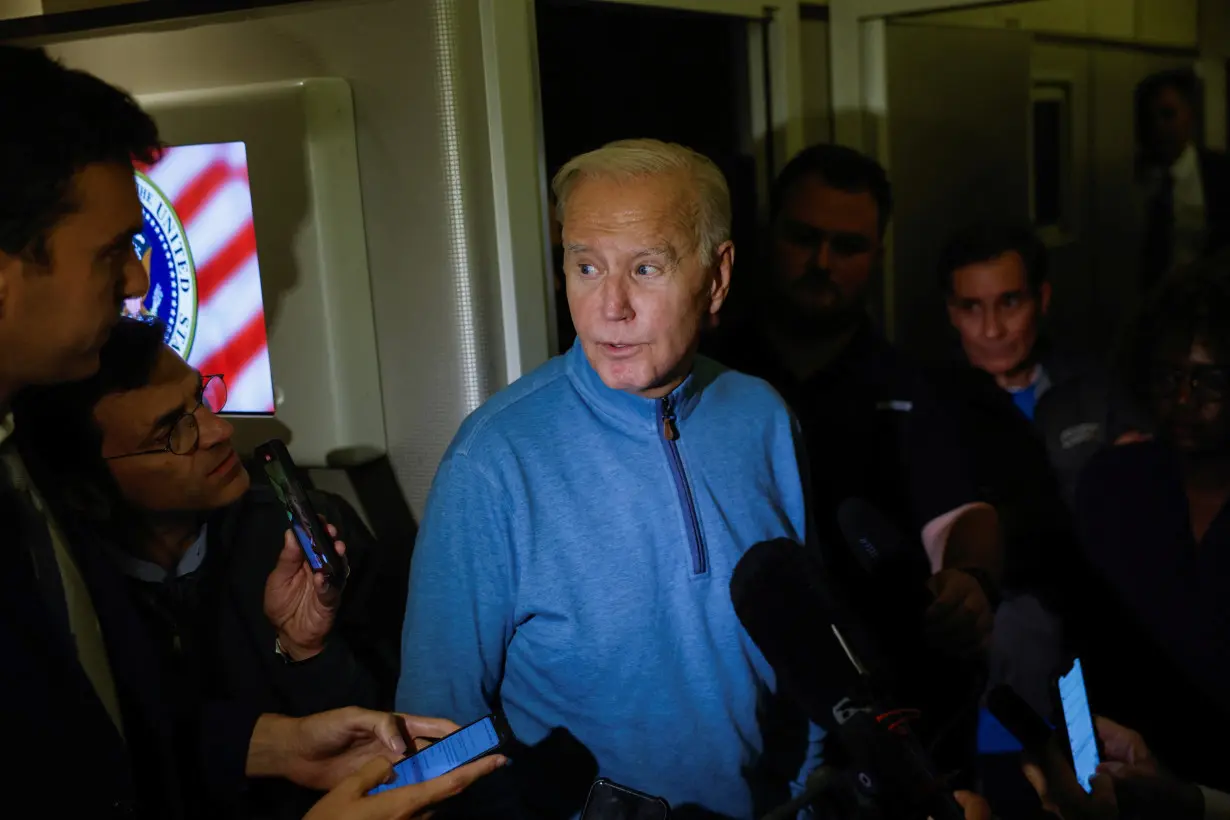 U.S. President Joe Biden speaks to the press onboard of Air Force One en route from Israel at Ramstein Air Base