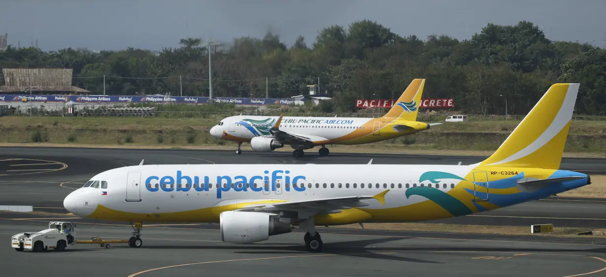 FILE PHOTO: Cebu Pacific passenger jets are pictured at the tarmac of Terminal 3 at the Ninoy Aquino International aiport in Pasay city, Metro Manila