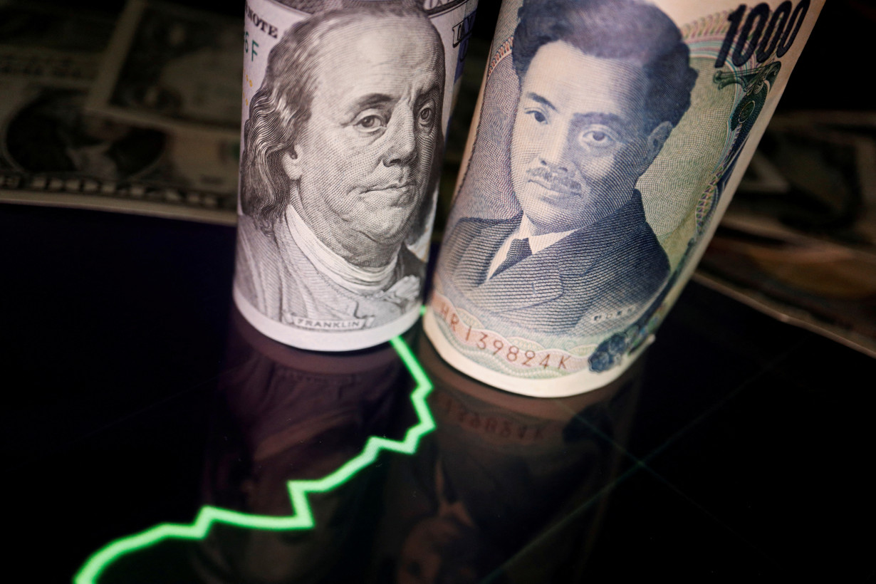 FILE PHOTO: Illustration picture of Japanese yen and U.S. dollar banknotes