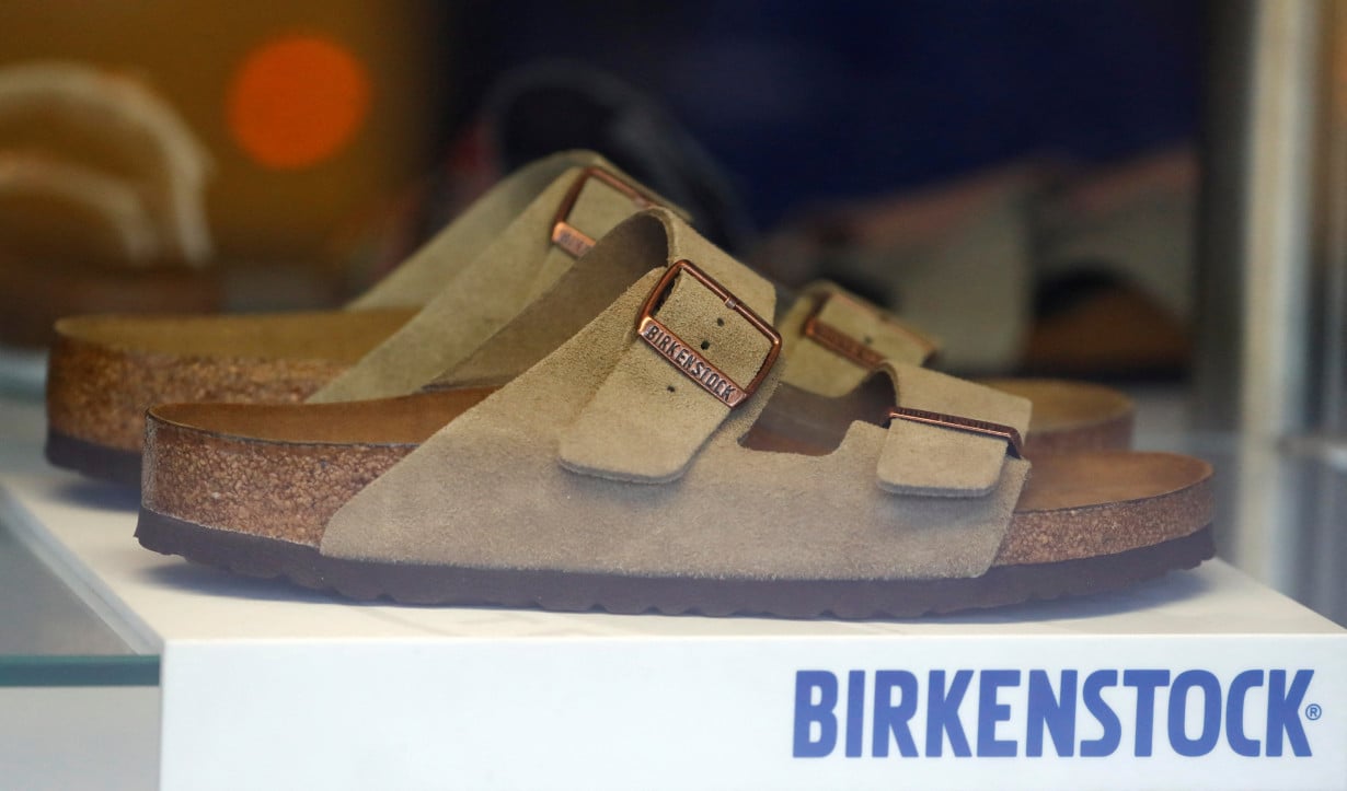 FILE PHOTO: A pair of shoes is pictured in a window of a Birkenstock footwear store in Berlin