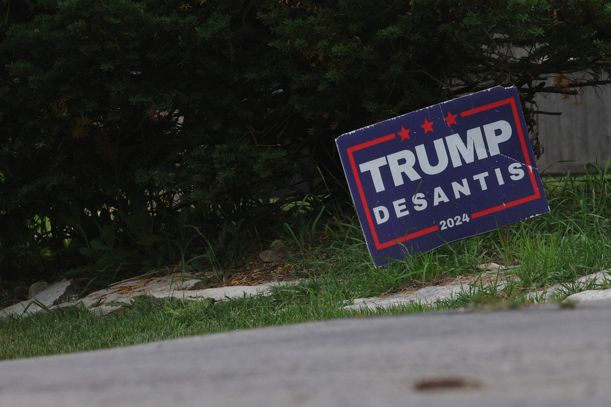 A campaign yard sign featuring Republican presidential candidates Trump and DeSantis stands in Racine