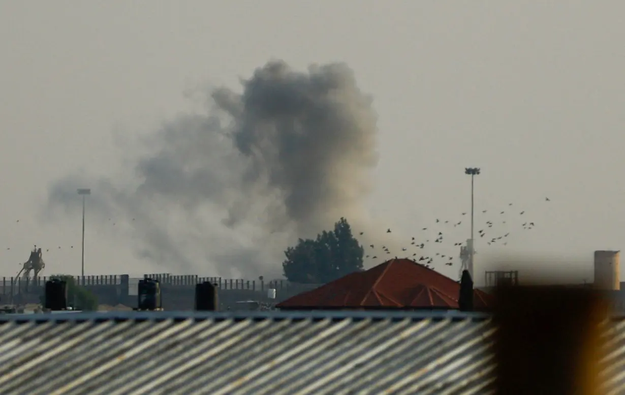 Smoke rises following Israeli strikes at the border with Egypt