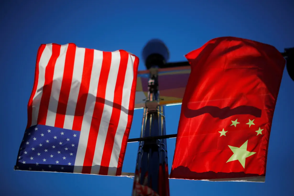 The flags of the United States and China fly in Boston