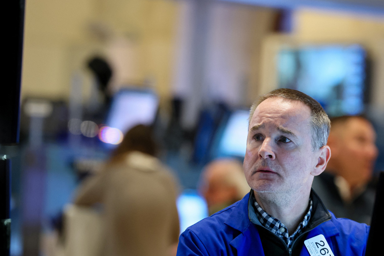 Traders work on the floor of the NYSE in New York