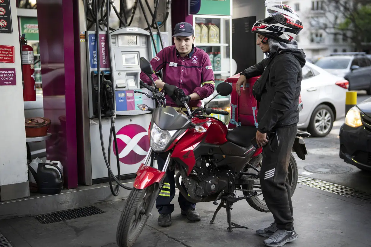 Drivers in Argentina wait in long lines to fill up the tanks as presidential election looms