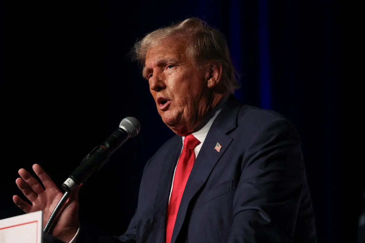 FILE PHOTO: Former U.S. President and Republican presidential candidate Trump meets with supporters in West Palm Beach