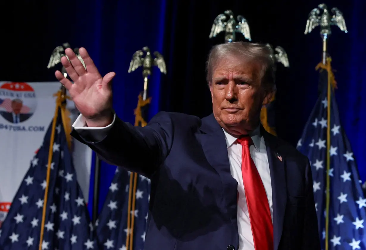 FILE PHOTO: Former U.S. President and Republican presidential candidate Trump meets with supporters in West Palm Beach