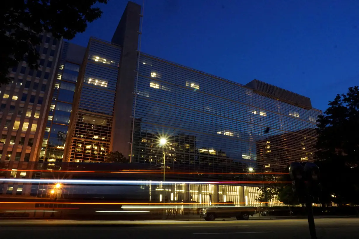 Vehicles pass in front of the World Bank building, which houses the International Centre for Settlement of Investment Disputes