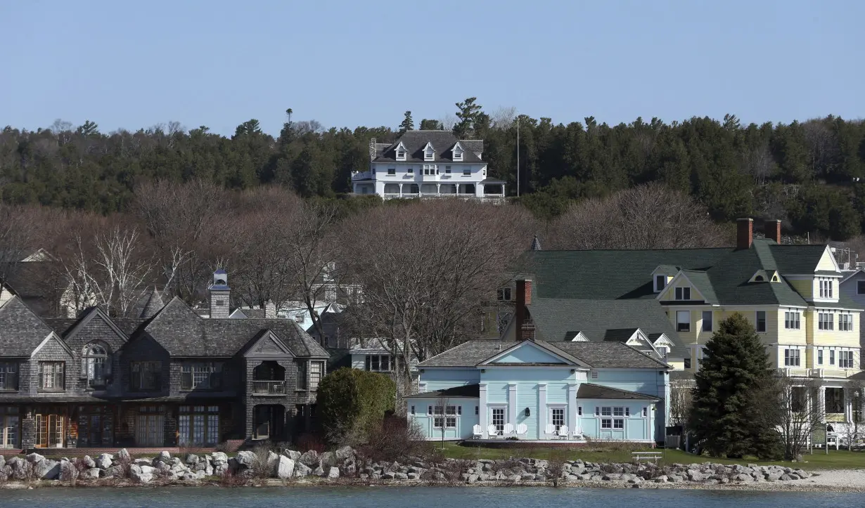 Man stopped near Michigan governor's home worked on research against Democrats, report says