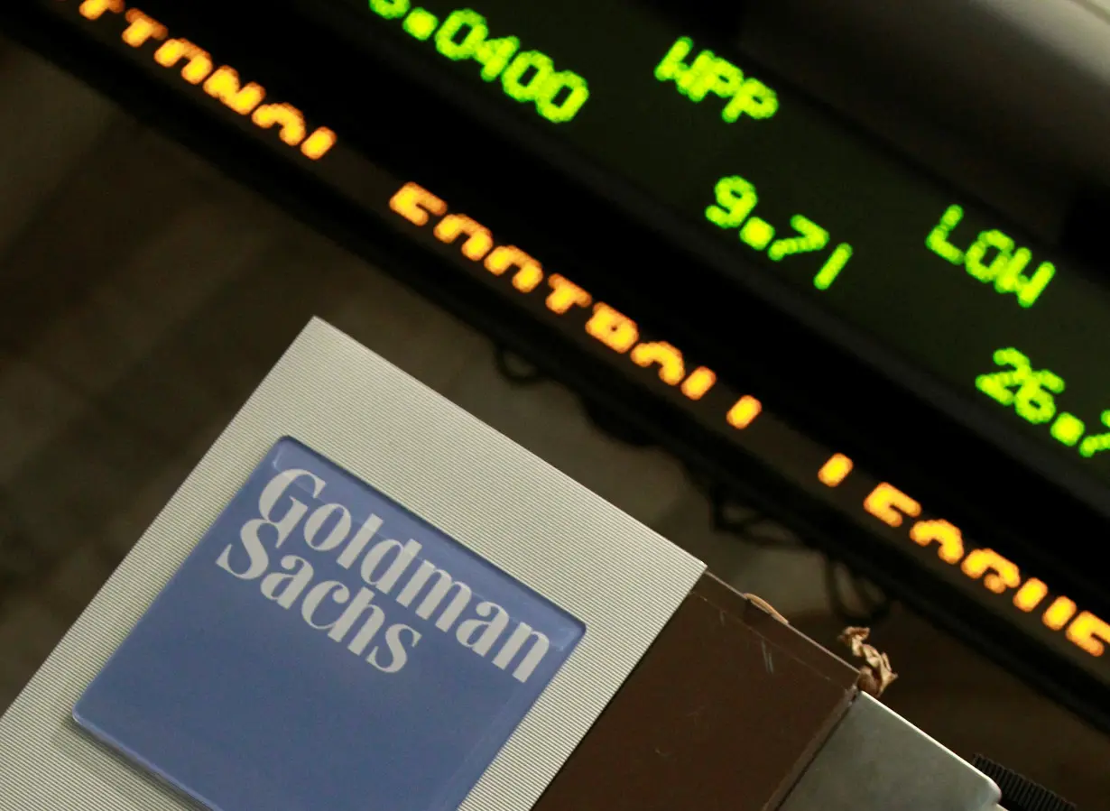 FILE PHOTO: A Goldman Sachs sign is seen at the New York Stock Exchange