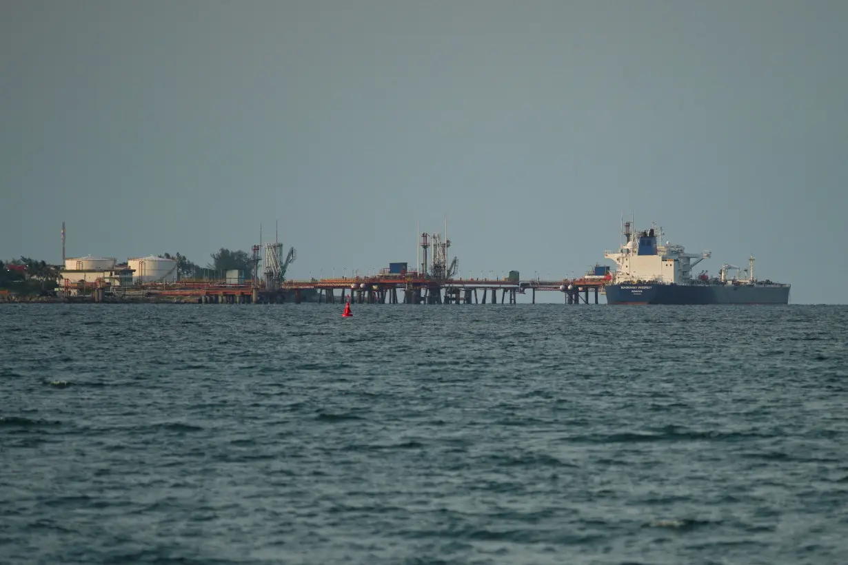 FILE PHOTO: Tanker carrying barrels of Russian fuel oil delivers its cargo in Matanzas