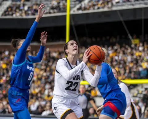 Clark's triple-double highlights game at Kinnick. Women's basketball record crowd of 55,646 shows up