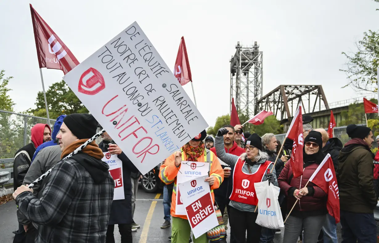 Strikers have shut down a vital Great Lakes shipping artery for days, and negotiations are looming