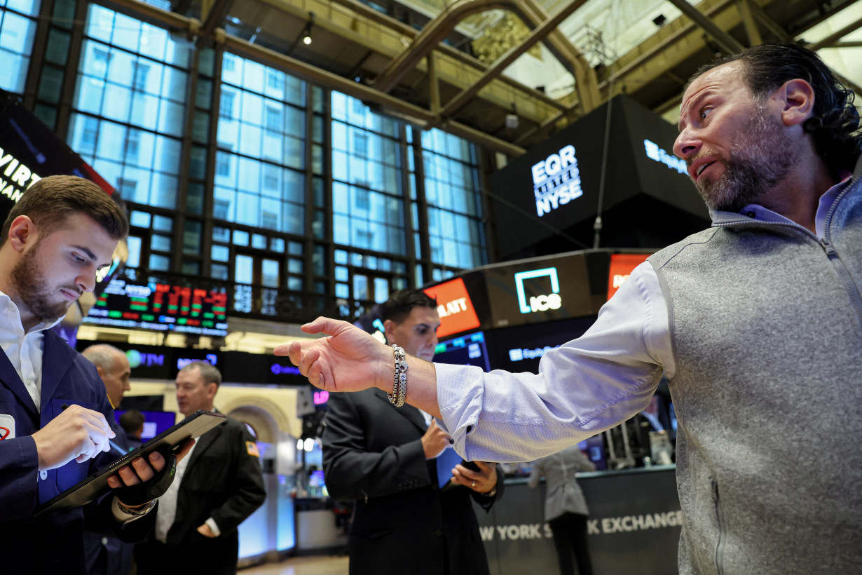 Traders work on the floor of the NYSE in New York