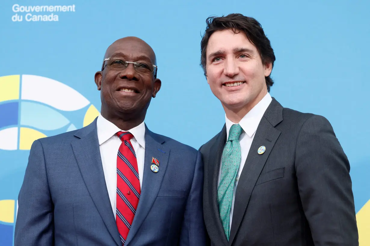 FILE PHOTO: Canada's Prime Minister Justin Trudeau greets Trinidad and Tobago's Prime Minister Keith Rowley at the Canada-CARICOM Summit in Ottawa