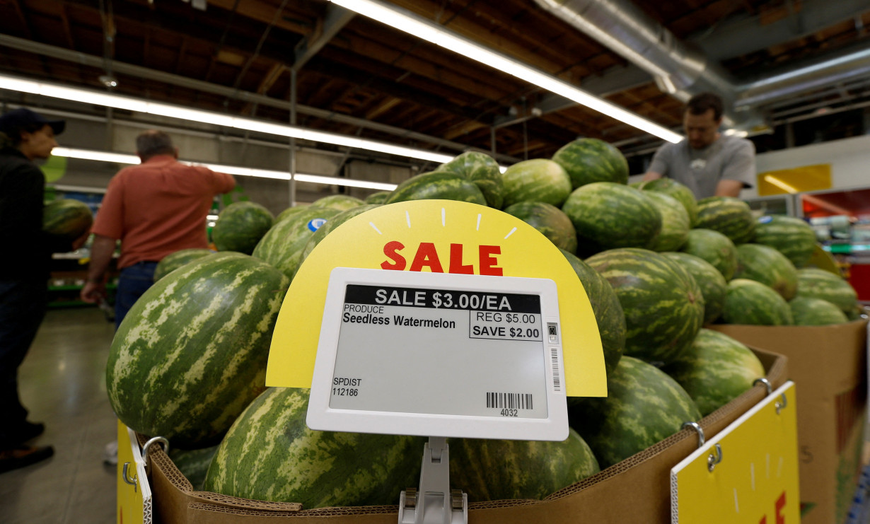 FILE PHOTO: Watermelon prices are displayed on a digital price tag at a 365 by Whole Foods Market grocery store ahead of its opening day in Los Angeles