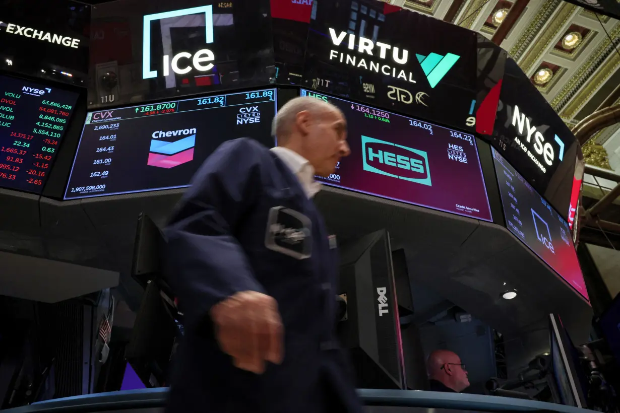 Traders work on the floor of the NYSE in New York