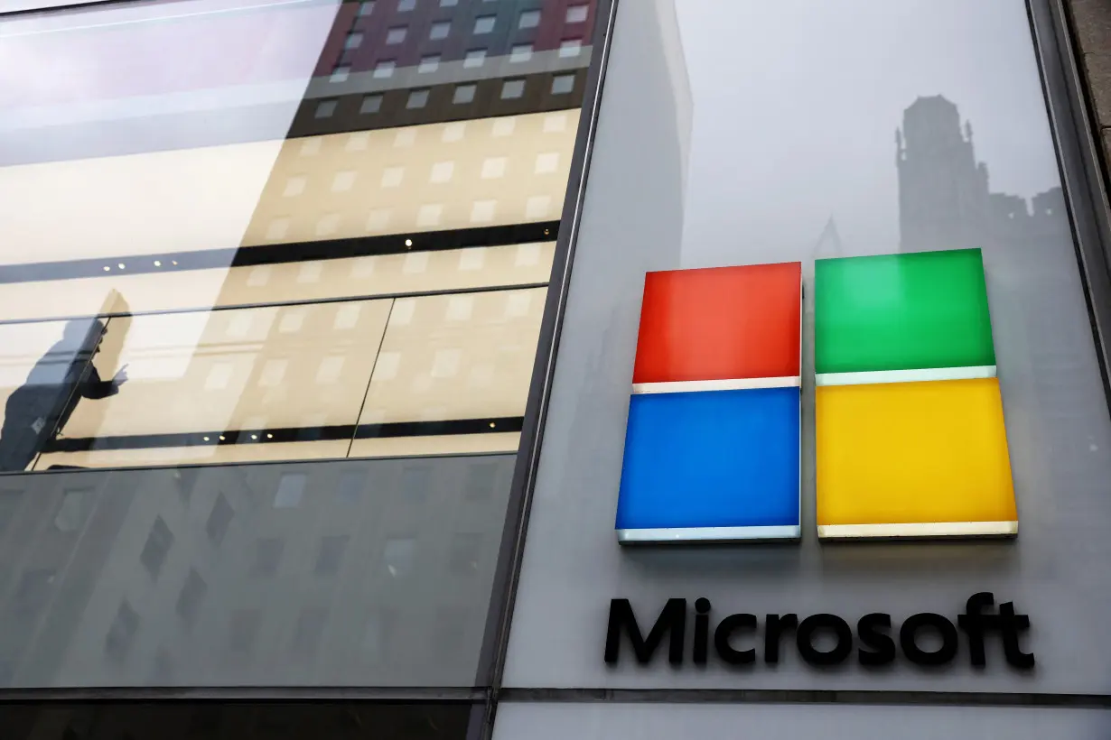 A man stands inside the Microsoft Experience Center in New York City