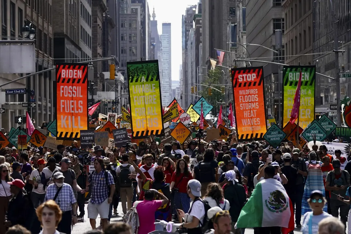 Tens of thousands march to kick off climate summit, demanding end to warming-causing fossil fuels