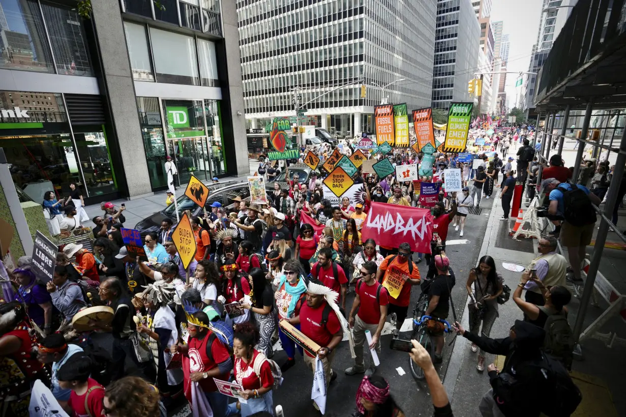 Tens of thousands march to kick off climate summit, demanding end to warming-causing fossil fuels