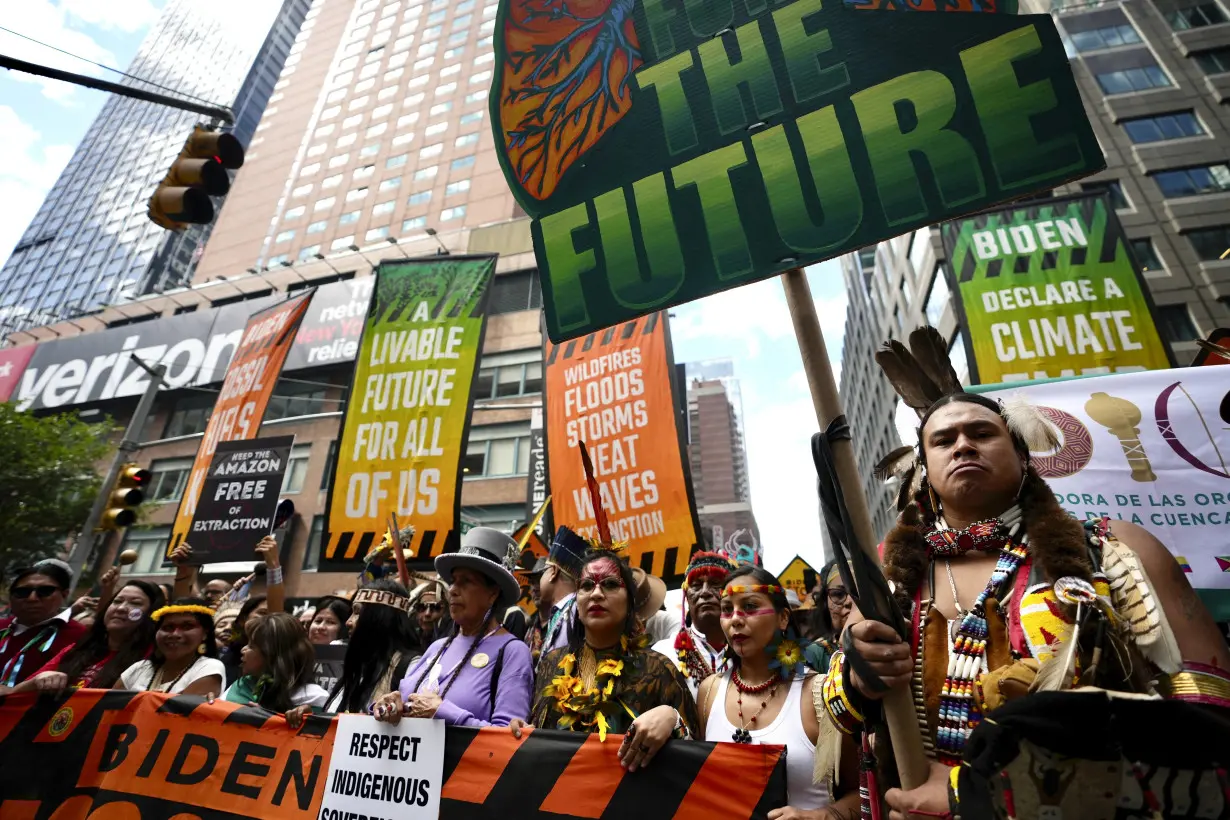 Tens of thousands march to kick off climate summit, demanding end to warming-causing fossil fuels