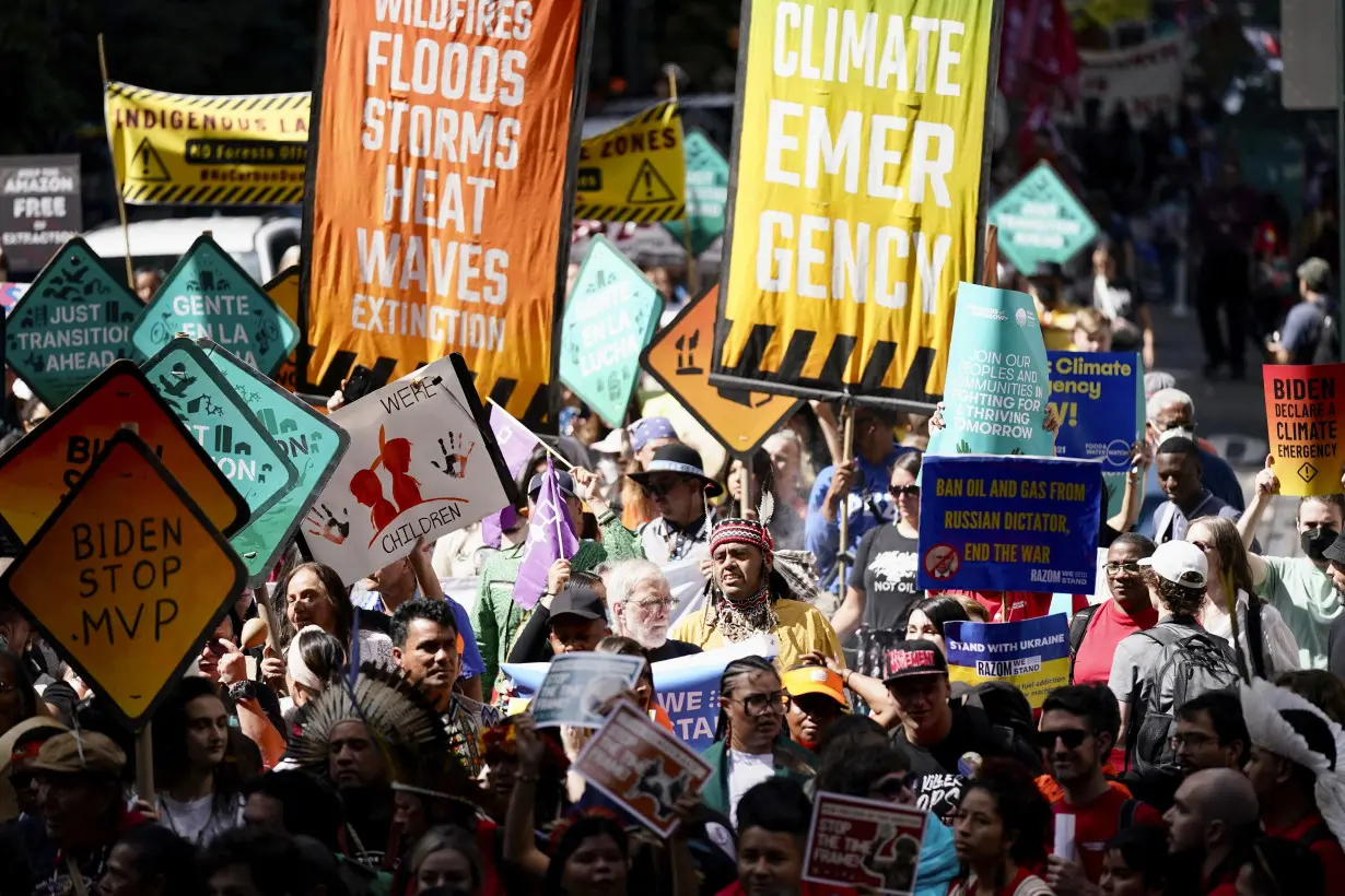 Tens of thousands march to kick off climate summit, demanding end to warming-causing fossil fuels