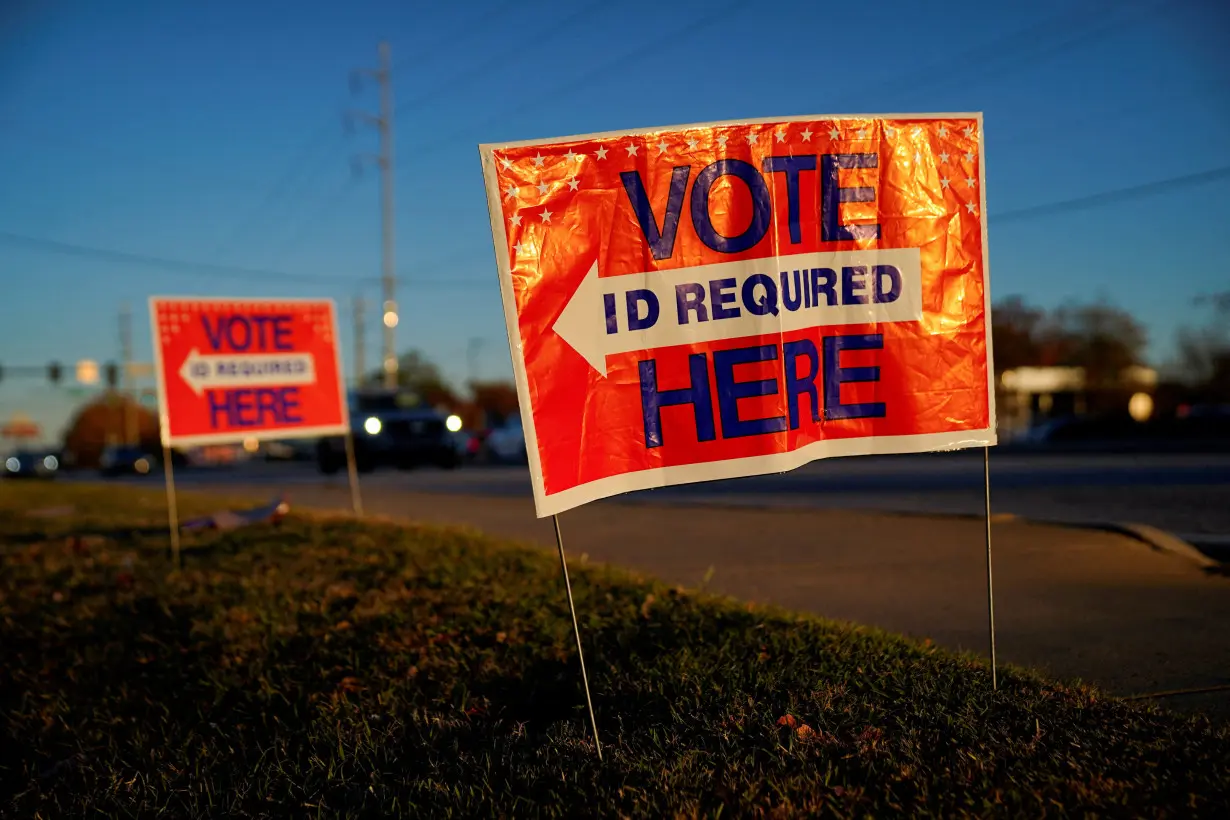 FILE PHOTO: Voters line up to cast their ballots for the U.S. Senate runoff election in Columbus