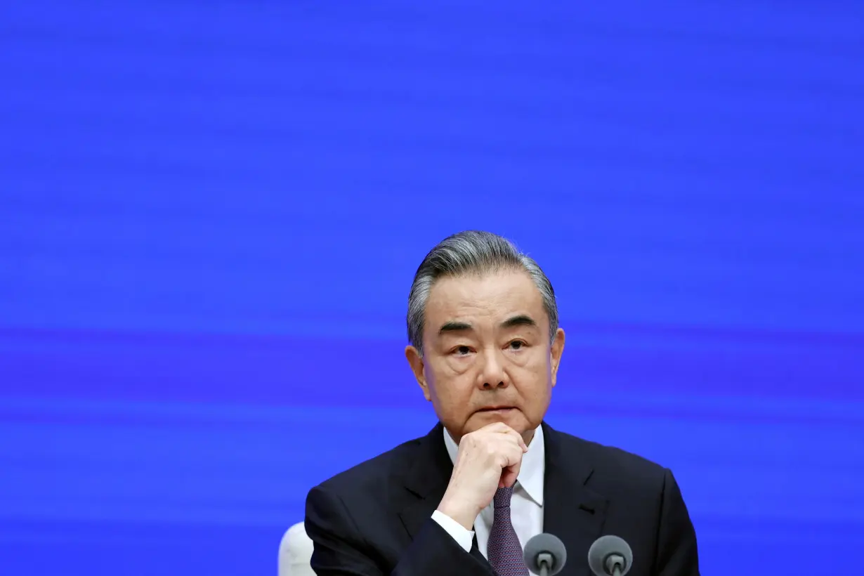 FILE PHOTO: Chinese Foreign Minister Wang Yi attends a press conference in Beijing