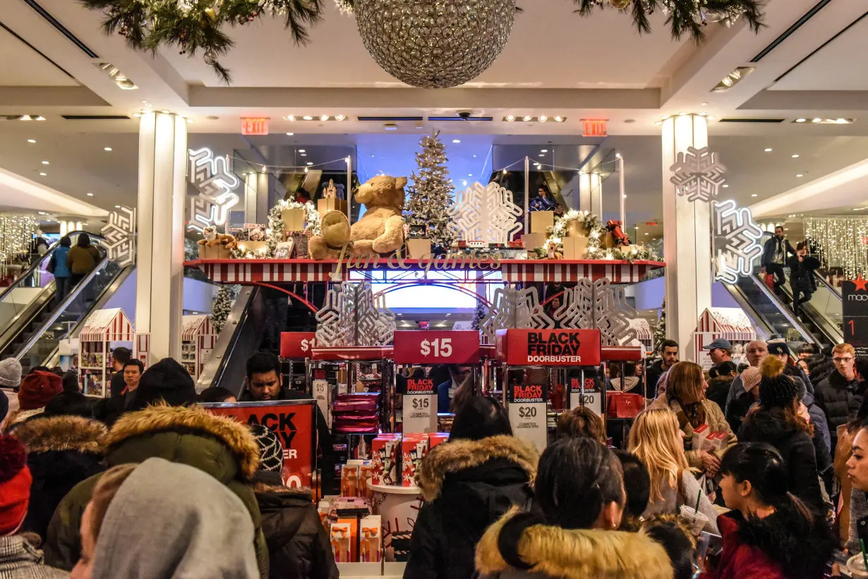 FILE PHOTO: People shop during a Black Friday sales event at Macy's flagship store in New York City