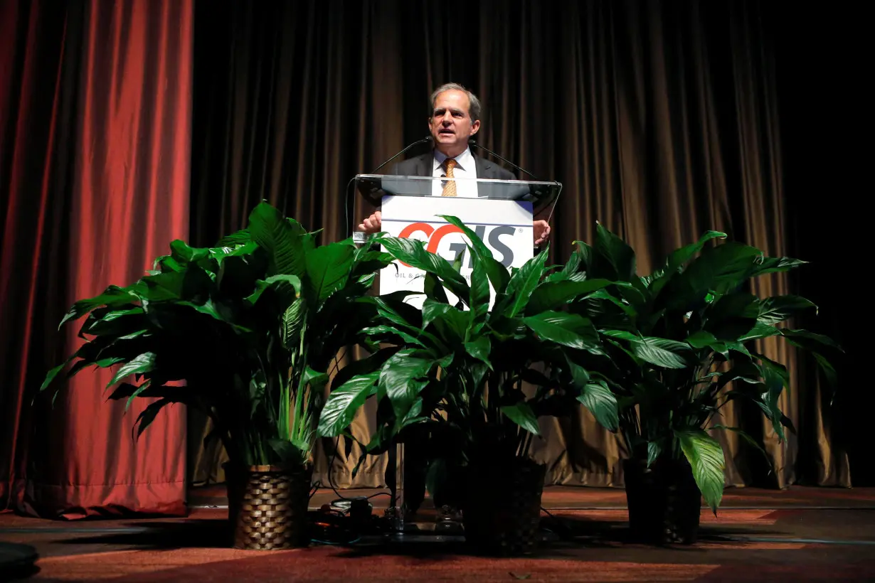 FILE PHOTO: Sheffield, Chairman and CEO of Pioneer Natural Resources Company, speaks to guests and investors during the OGIS conference for mid- and small-tier oil and gas companies in New York